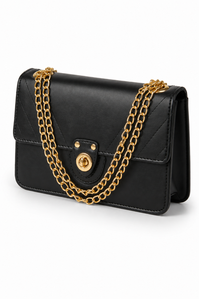 Vogue black handbag with gold chain, angled view