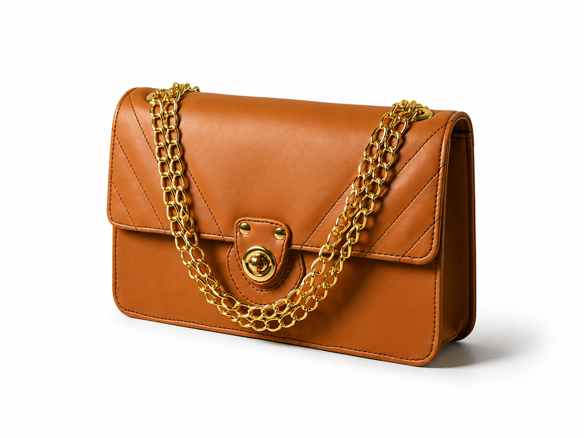 Vogue brown handbag with gold chain, angled view
